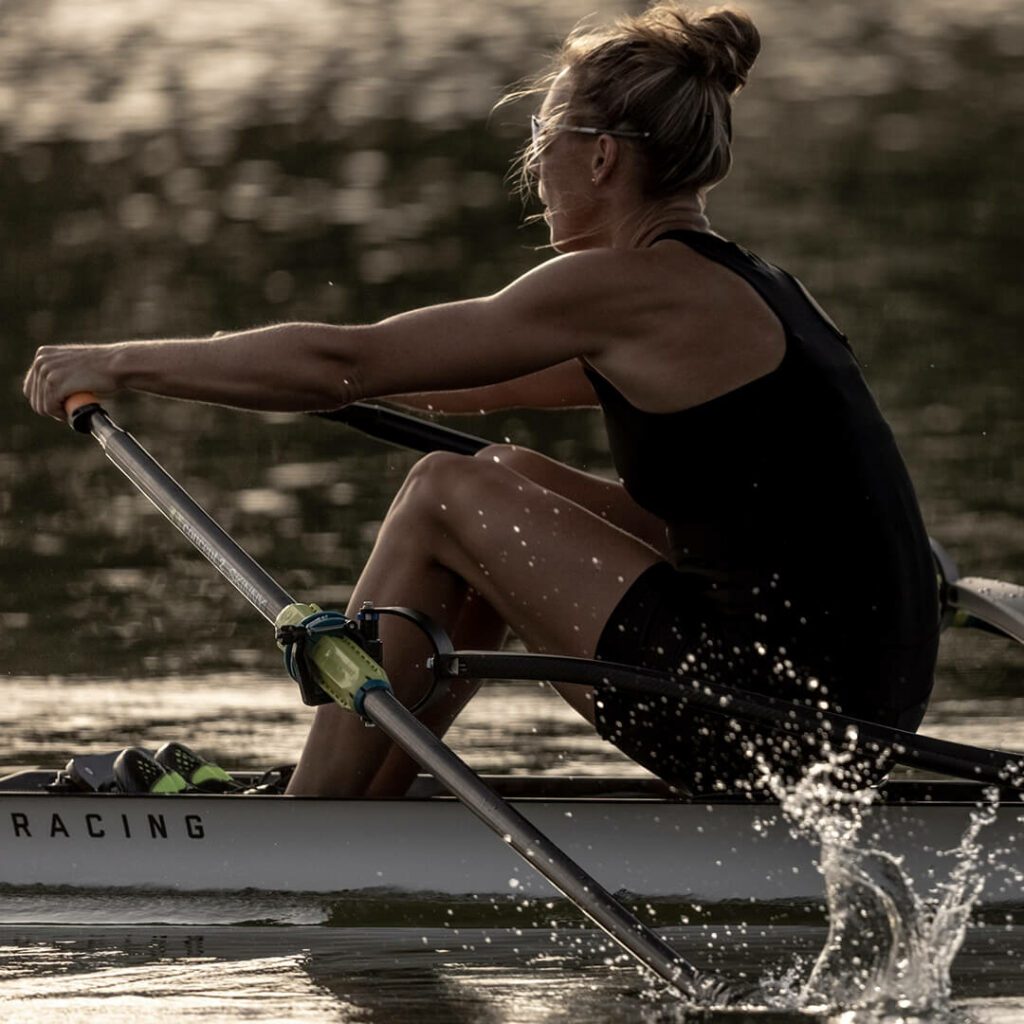Emma Twigg racing in SL Racing single scull rowing boat on the water