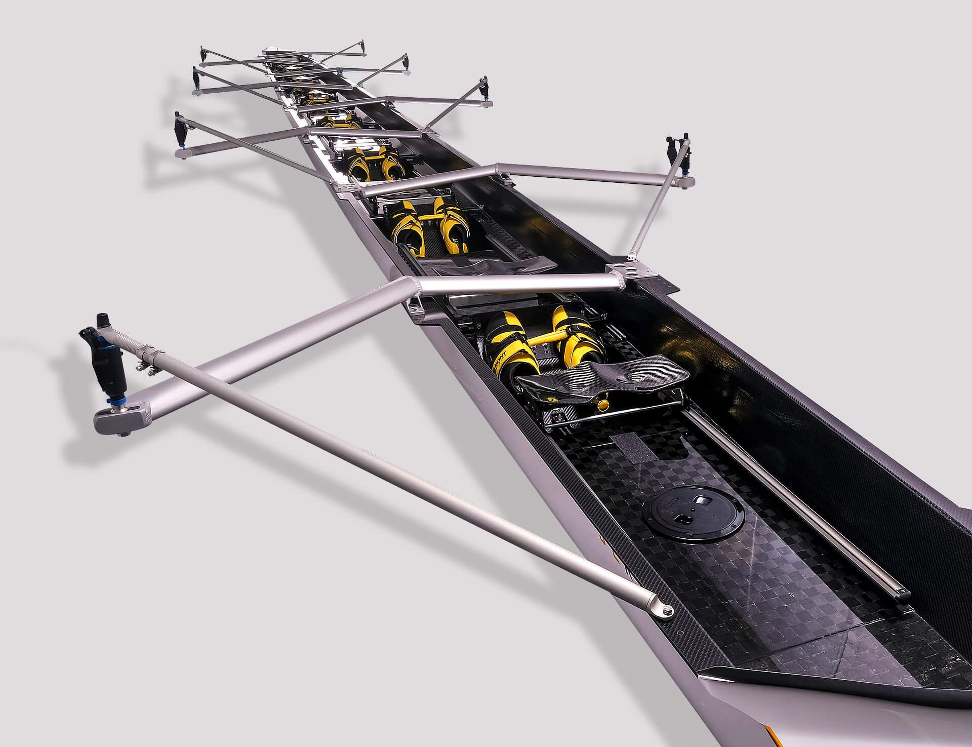 product shot of the SL Racing eights-rowing-boat-skiff-models with aluminium rigging and yellow and black shoes inside. aluminium rigging and yellow and black shoes inside.
