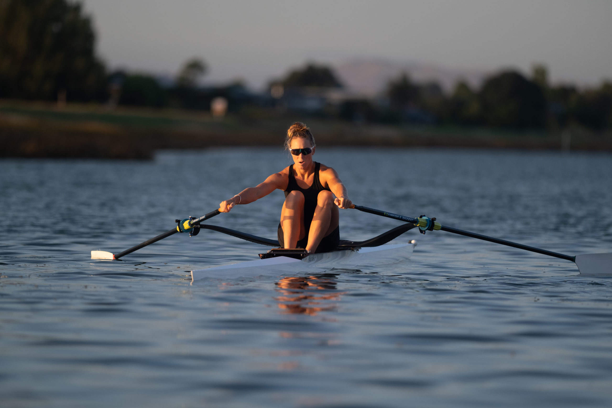 Olympic champion rower, Emma Twigg rows a single rowing skiff made by SL Racing on the Clive River.